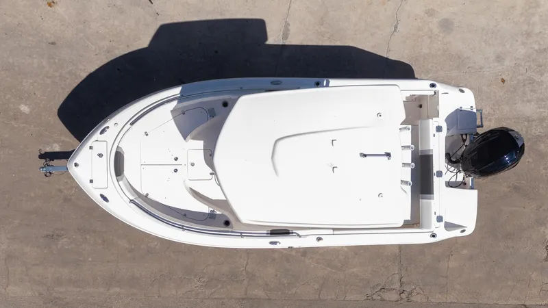 Slide: The Image of Overhead view of 2025 Robalo R222 boat on concrete surface. - 24