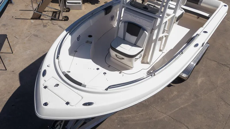 Slide: The Image of 2025 Robalo R222 boat, white interior, spacious deck, modern design, parked on trailer. - 5