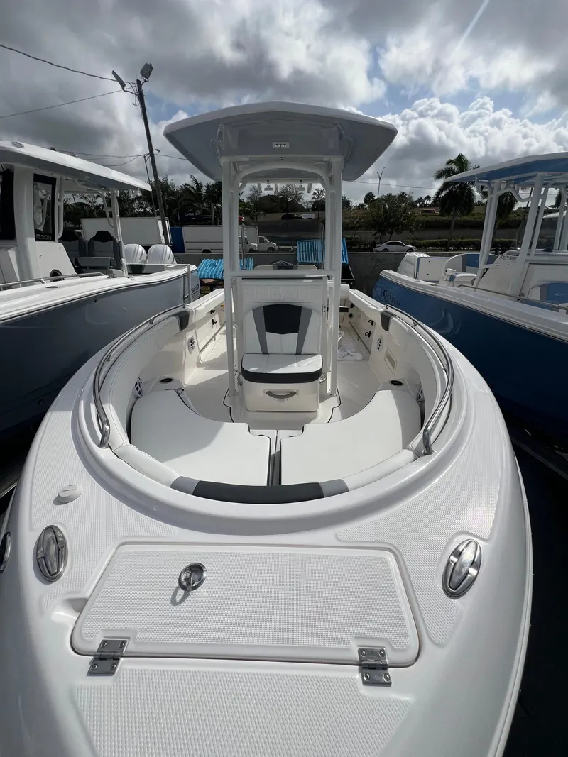 Slide: The Image of 2025 Robalo R222 boat with sleek white interior and spacious seating. - 6