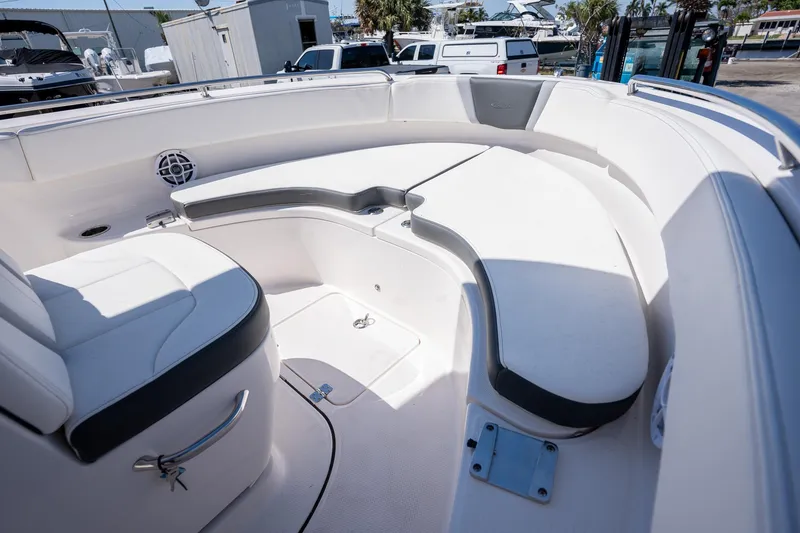 Slide: The Image of 2025 Robalo R222 boat interior with white seating and storage compartments. - 7