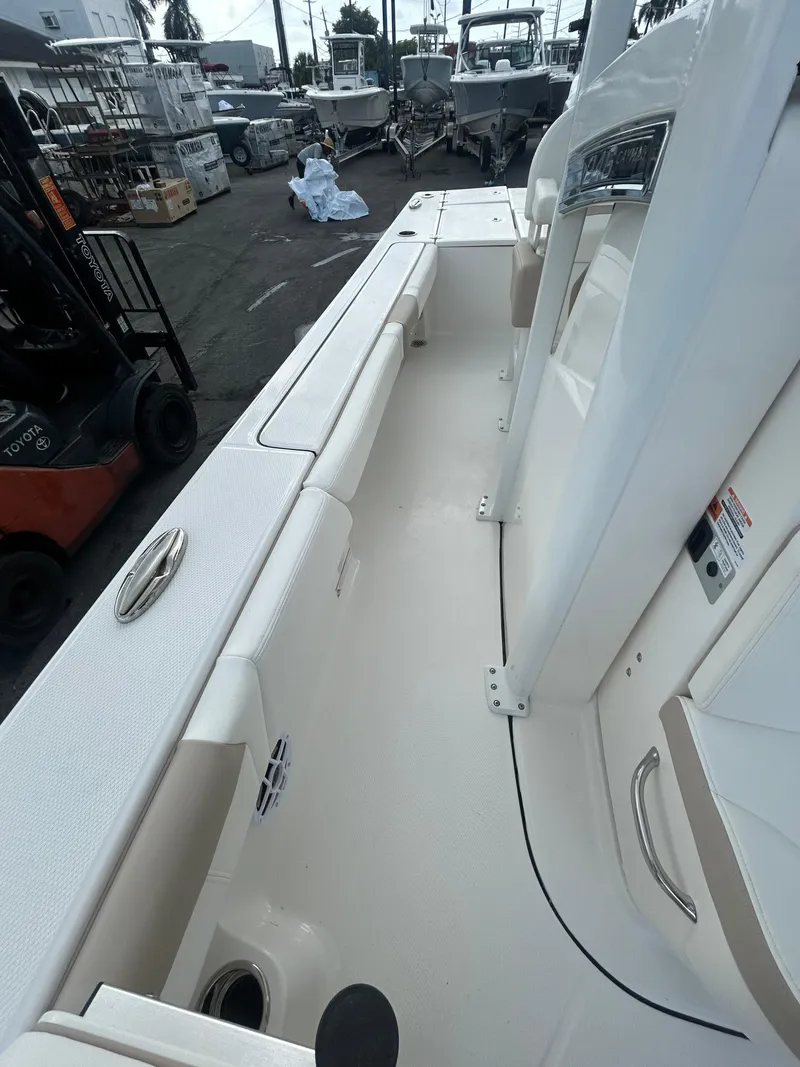 Slide: The Image of 2025 Robalo 246 Cayman boat interior, showcasing sleek design and spacious layout. - 8