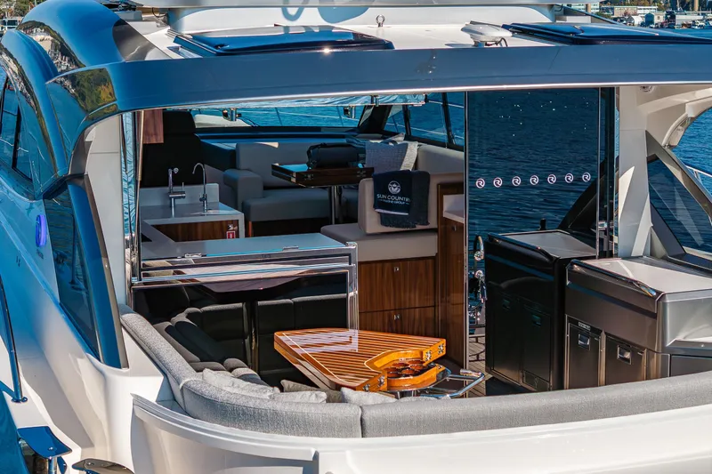 Slide: The Image of 2025 Riviera 4600 Sport Yacht with luxurious interior and sleek design on the water. - 20