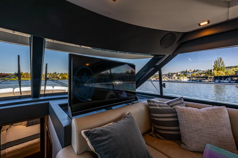 Slide: The Image of Luxurious interior of 2025 Riviera 4600 Sport Yacht with waterfront view. - 36