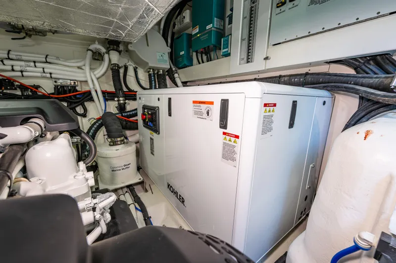 Slide: The Image of Engine room of 2025 Riviera 4600 Sport Yacht with Kohler generator and marine equipment. - 50