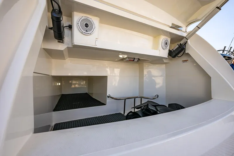 Slide: The Image of 2025 Riviera 4600 Sport Yacht storage area with speakers and equipment. - 52