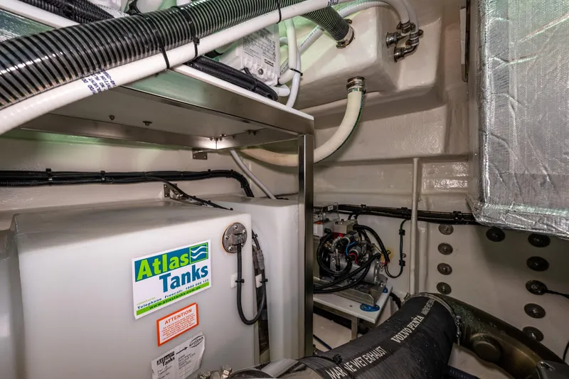 Slide: The Image of Engine room of 2025 Riviera 4600 Sport Yacht with Atlas Tanks and piping. - 54