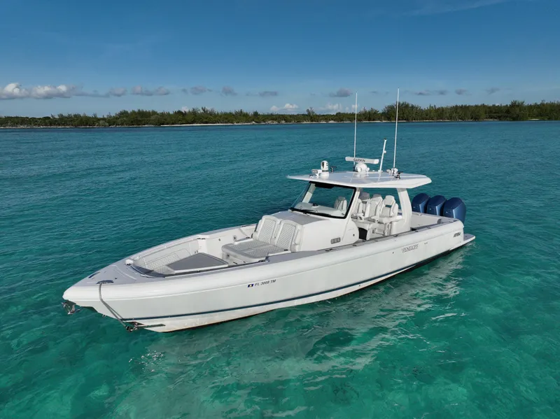 Slide: The Image of 2023 Intrepid 427 Nomad SE boat on clear turquoise water. - 17