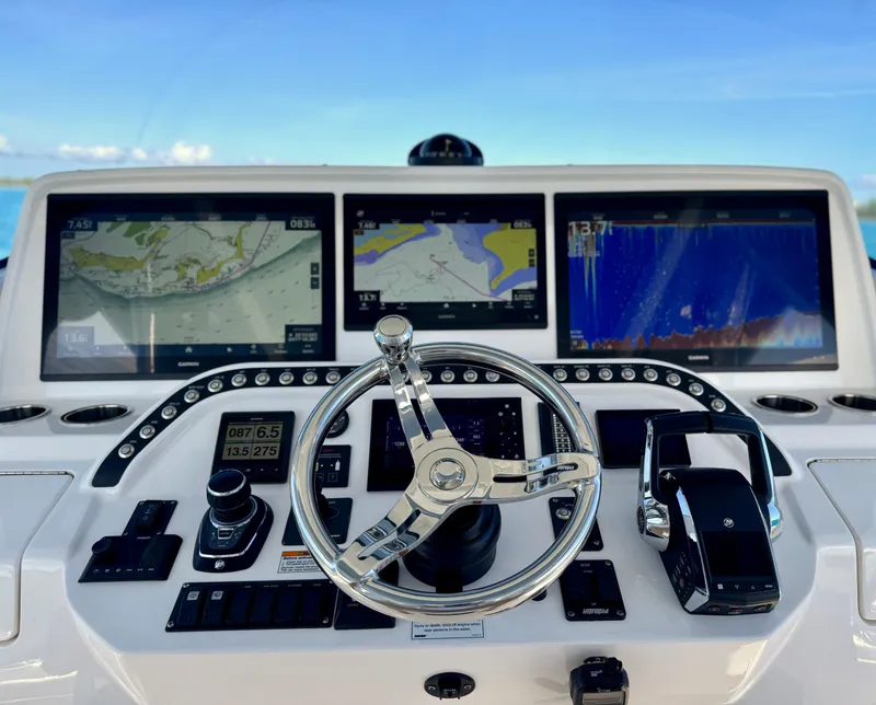 Slide: The Image of 2023 Intrepid 427 Nomad SE dashboard with advanced navigation displays and controls. - 3