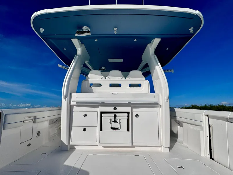 Slide: The Image of 2023 Intrepid 427 Nomad SE boat interior with sleek design and modern amenities. - 8