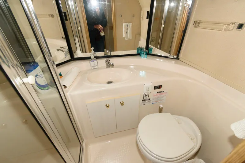 Slide: The Image of Bathroom interior of 1998 Bayliner 4788 Pilot House Motoryacht, featuring sink and toilet. - 20