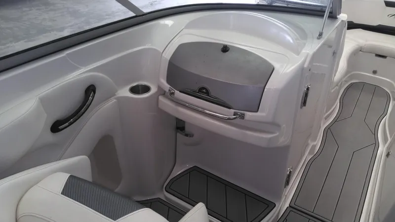 Slide: The Image of 2008 Monterey 254 FS boat interior with seating and storage compartment. - 11