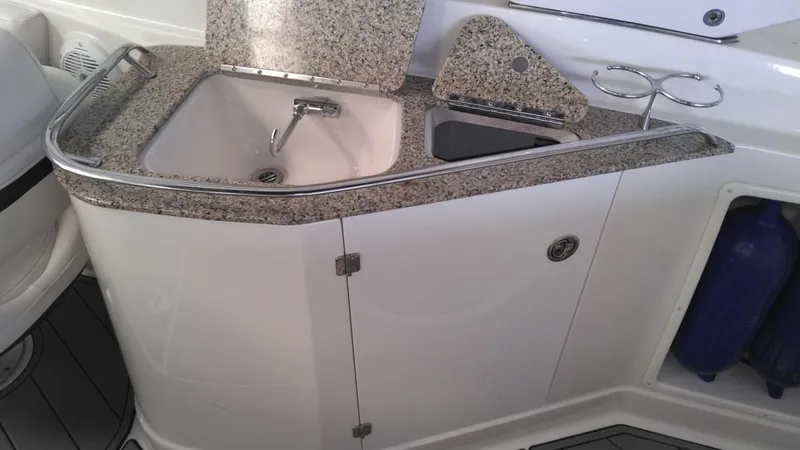 Slide: The Image of 2008 Monterey 254 FS boat kitchenette with sink and granite countertop. - 14