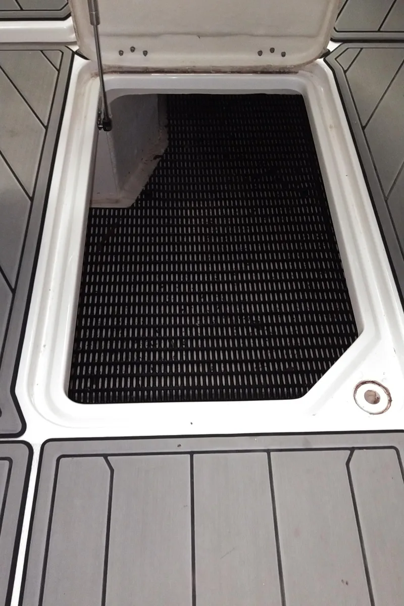 Slide: The Image of Open storage compartment on 2008 Monterey 254 FS boat deck. - 22