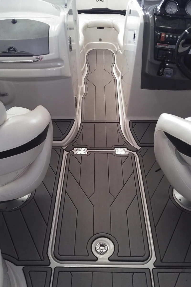 Slide: The Image of 2008 Monterey 254 FS boat interior with sleek seating and modern dashboard. - 23