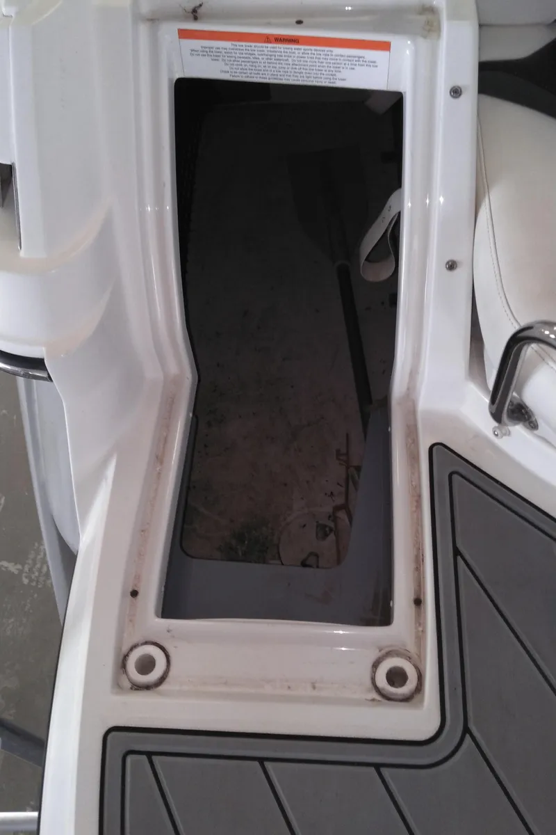 Slide: The Image of 2008 Monterey 254 FS boat storage compartment with open hatch. - 24