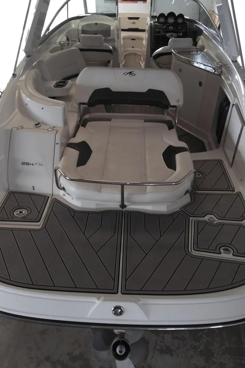 Slide: The Image of 2008 Monterey 254 FS boat interior with seating and deck view. - 25