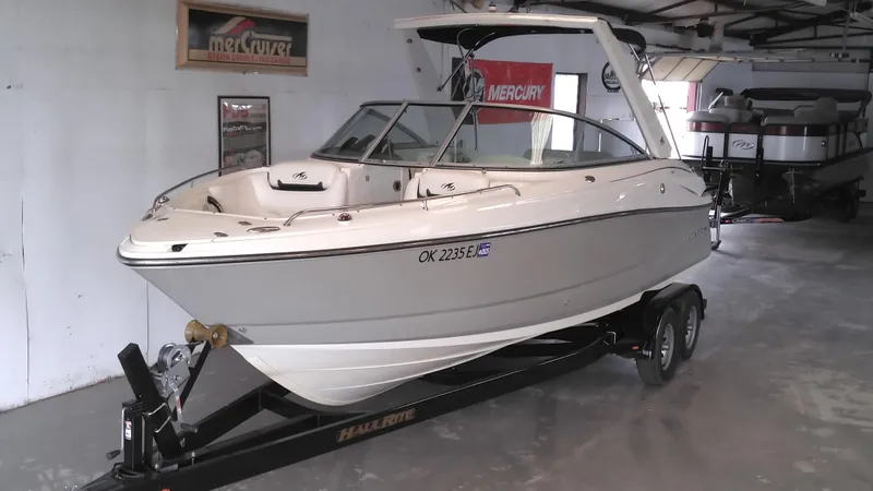 Slide: The Image of 2008 Monterey 254 FS boat on trailer in indoor showroom. - 6