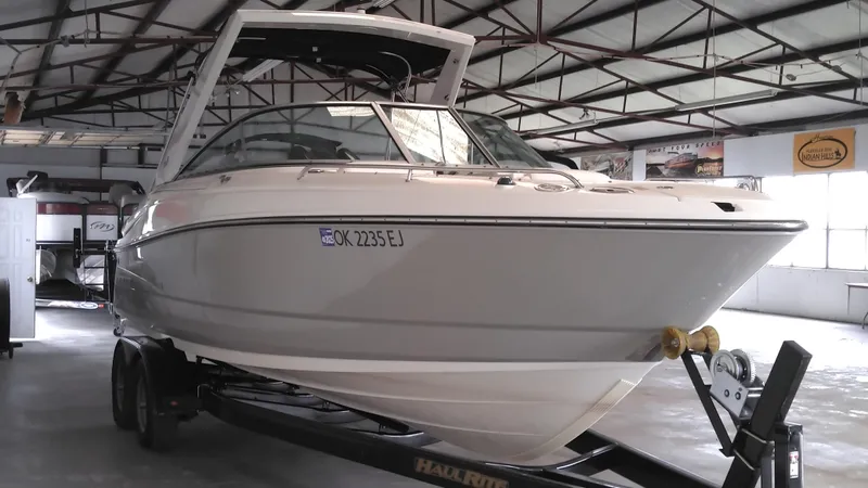 Slide: The Image of 2008 Monterey 254 FS boat on trailer in indoor storage facility. - 7