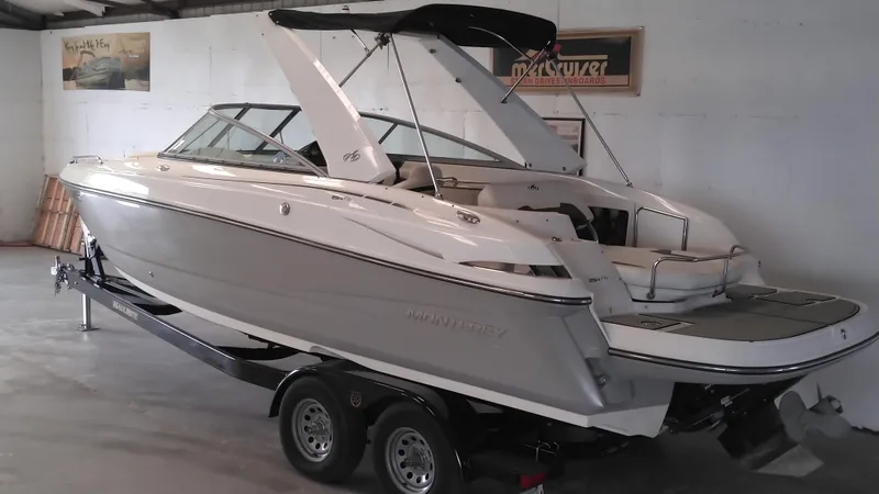 Slide: The Image of 2008 Monterey 254 FS boat on trailer in indoor storage. - 8