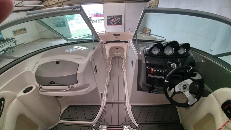 Slide: The Image of 2008 Monterey 254 FS boat interior with steering wheel and dashboard. - 9