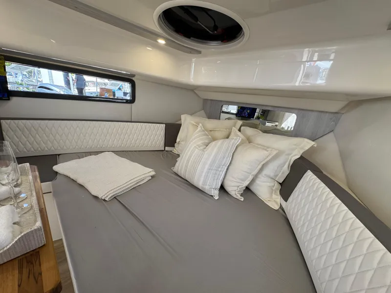 Slide: The Image of Luxurious interior of 2025 Hanover 387 yacht with plush bedding and elegant design. - 5