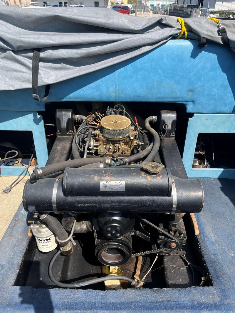 Slide: The Image of 1974 Sea Ray SRV 220 CC engine compartment with visible components and wiring. - 9