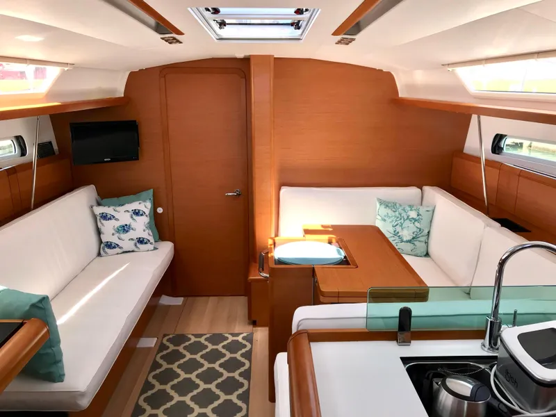 Slide: The Image of Interior of 2018 Jeanneau Sun Odyssey 419 yacht with modern seating and decor. - 16