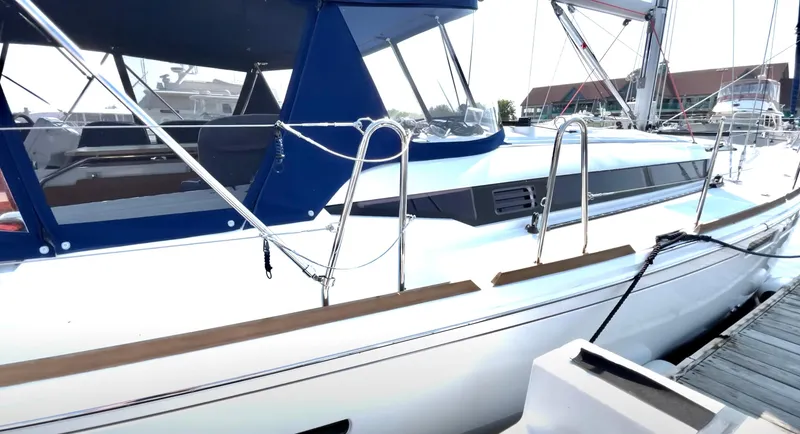 Slide: The Image of 2018 Jeanneau Sun Odyssey 419 sailboat docked at marina. - 6