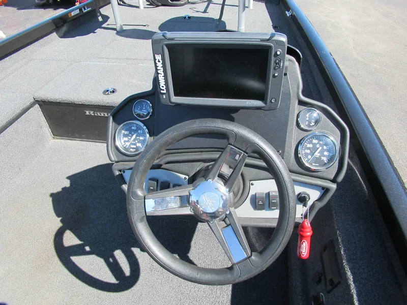 Slide: The Image of 2019 Ranger RT188C boat dashboard with steering wheel and Lowrance fishfinder. - 2