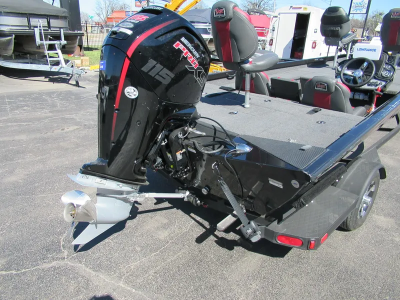 Slide: The Image of 2019 Ranger RT188C boat with powerful outboard motor, parked on a trailer. - 5