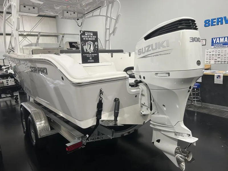 Slide: The Image of 2025 Sea Pro 240 Dual Console boat with Suzuki 300 outboard motor on trailer. - 4