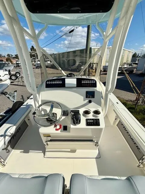 Slide: The Image of 2025 Avenger AV26 boat cockpit with steering wheel and control panel. - 4