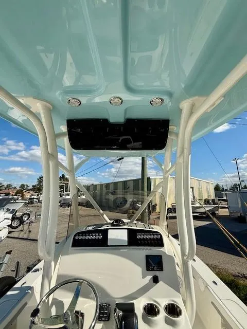 Slide: The Image of 2025 Avenger AV26 boat cockpit with modern controls and blue canopy. - 5