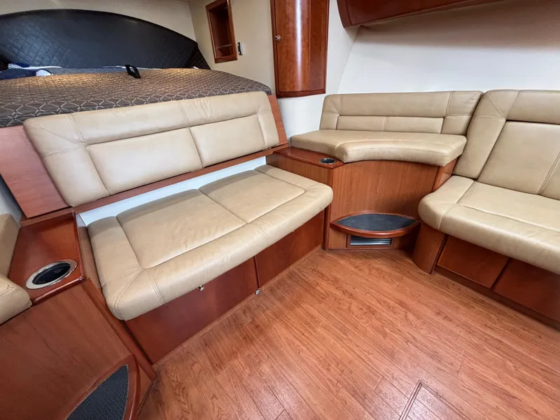 Slide: The Image of Interior of 2011 Luhrs 37 Canyon IPS yacht with beige leather seating and wood finish. - 42