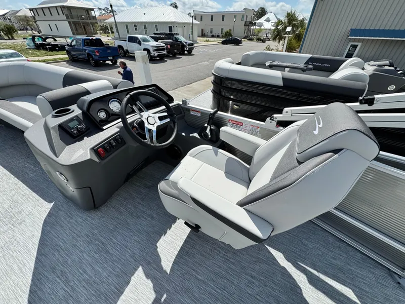 Slide: The Image of 2025 Bennington 22 SSB boat interior with modern helm and comfortable seating. - 10
