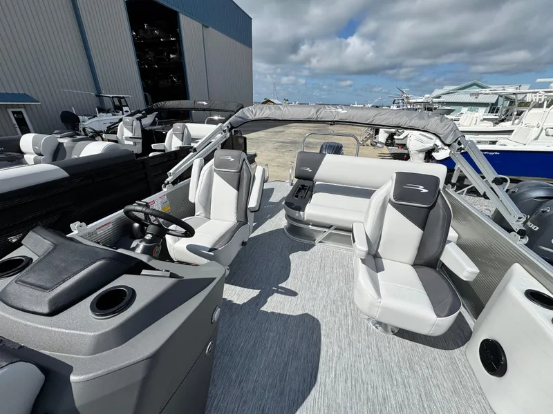 Slide: The Image of 2025 Bennington 22 SSB pontoon boat interior with modern seating and helm. - 8