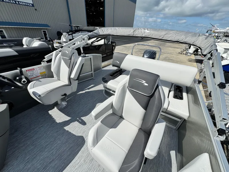 Slide: The Image of 2025 Bennington 22 SSB pontoon boat interior with plush seating and modern design. - 9