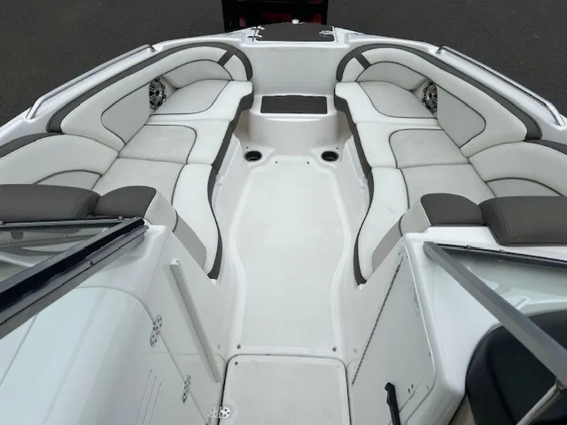 Slide: The Image of 2014 Yamaha 242 Limited S boat interior with spacious seating and sleek design. - 13