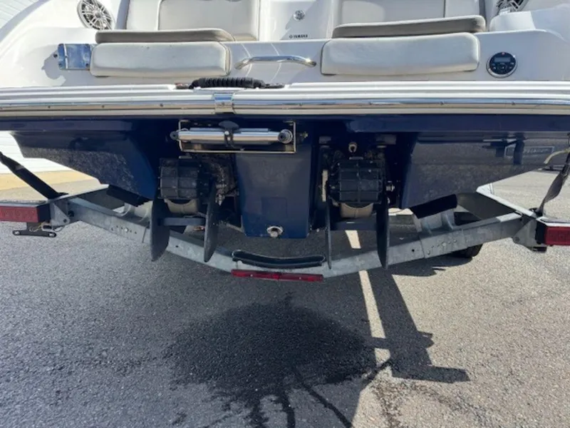 Slide: The Image of 2014 Yamaha 242 Limited S boat with galvanized trailer, rear view showing dual engines. - 5