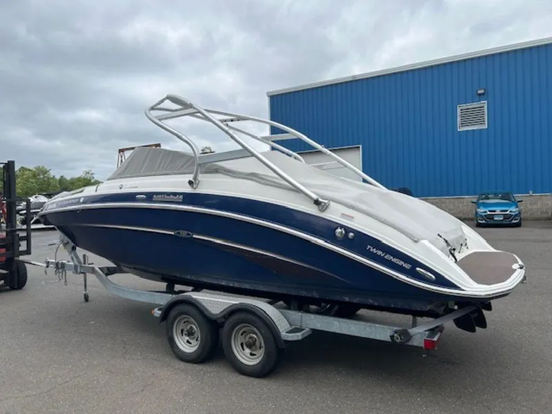 Slide: The Image of 2014 Yamaha Boats 242 Limited S on galvanized trailer, parked outdoors. - 6