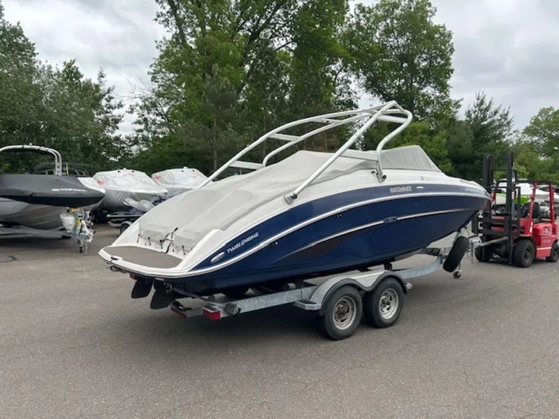 Slide: The Image of 2014 Yamaha 242 Limited S boat on galvanized trailer, parked outdoors. - 9