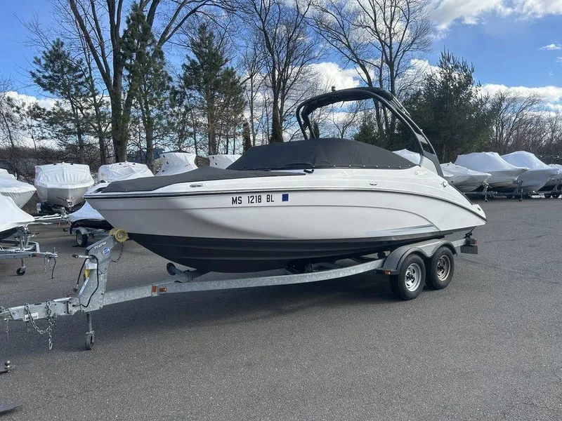 Slide: The Image of 2017 Yamaha Boats 212 Limited S on trailer, parked outdoors. - 12