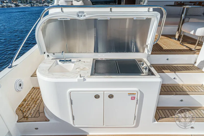 Slide: The Image of Outdoor kitchen on 2026 Riviera 58 Sports Motor Yacht with sink and grill. - 20