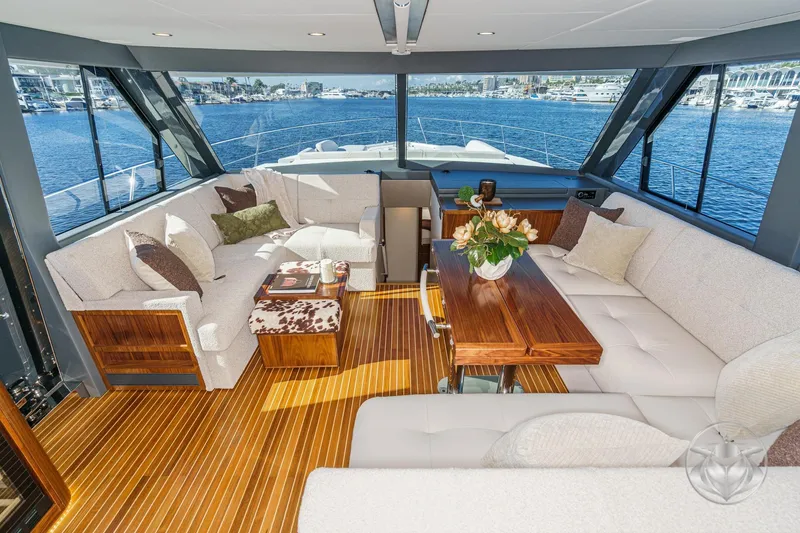 Slide: The Image of Luxurious interior of 2026 Riviera 58 Sports Motor Yacht with elegant seating and scenic views. - 35