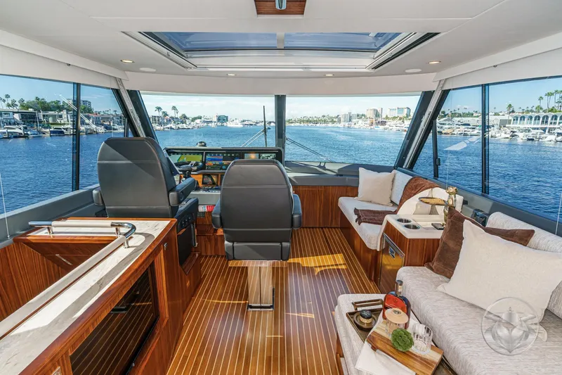 Slide: The Image of Luxurious interior of 2026 Riviera 58 Sports Motor Yacht with panoramic views. - 40