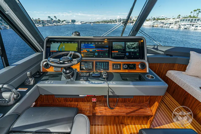 Slide: The Image of Helm of 2026 Riviera 58 Sports Motor Yacht with advanced navigation displays. - 42