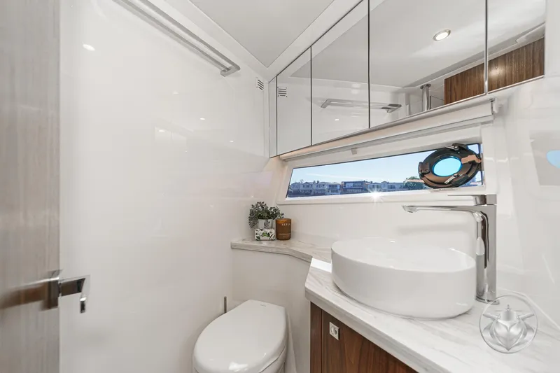 Slide: The Image of Luxurious bathroom in 2026 Riviera 58 Sports Motor Yacht with modern fixtures and elegant design. - 55