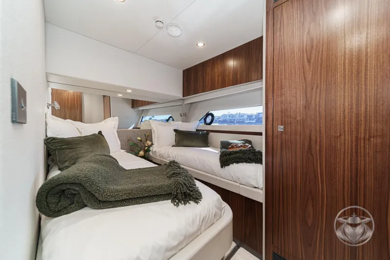 Slide: The Image of Luxurious cabin interior of 2026 Riviera 58 Sports Motor Yacht with elegant wood finishes. - 57