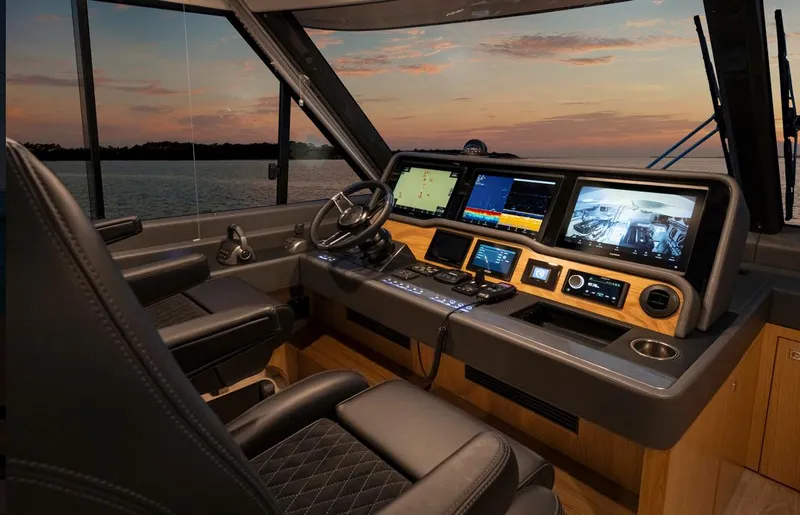 Slide: The Image of 2026 Riviera 58 Sports Motor Yacht cruising in a scenic marina setting. - 6