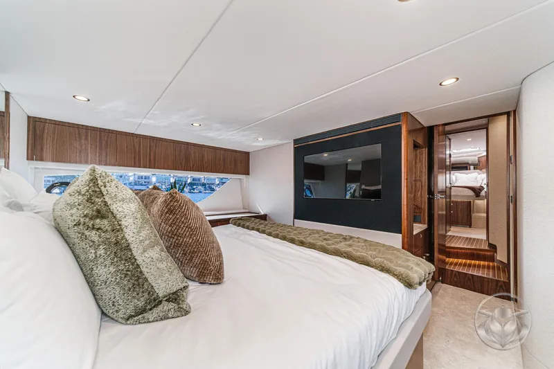 Slide: The Image of Luxurious bedroom interior of 2026 Riviera 58 Sports Motor Yacht with elegant decor. - 60